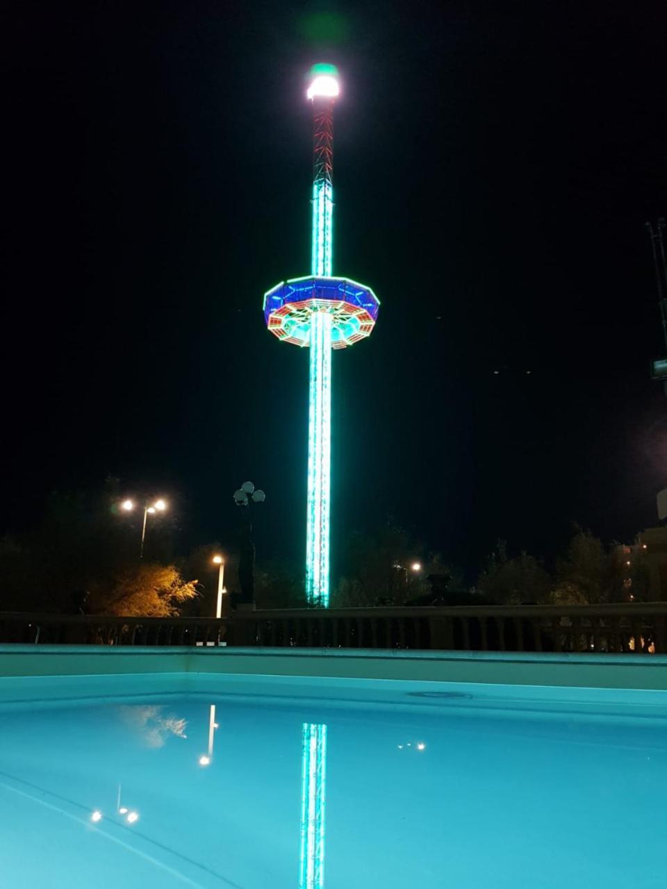 Hotel Vittoria Pesaro Exterior photo The observation tower at night